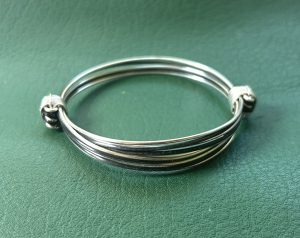 Lovely gift of silver and black faux elephant hair knots style